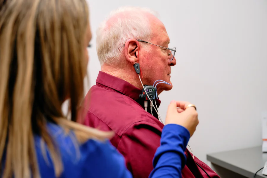 Dr. Mae Foster performing Real Ear Measurement on a patient